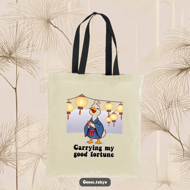 Funny goose tote bag showing a joyful goose in a blue kimono clapping near illuminated paper lanterns, a humorous and festive accessory.